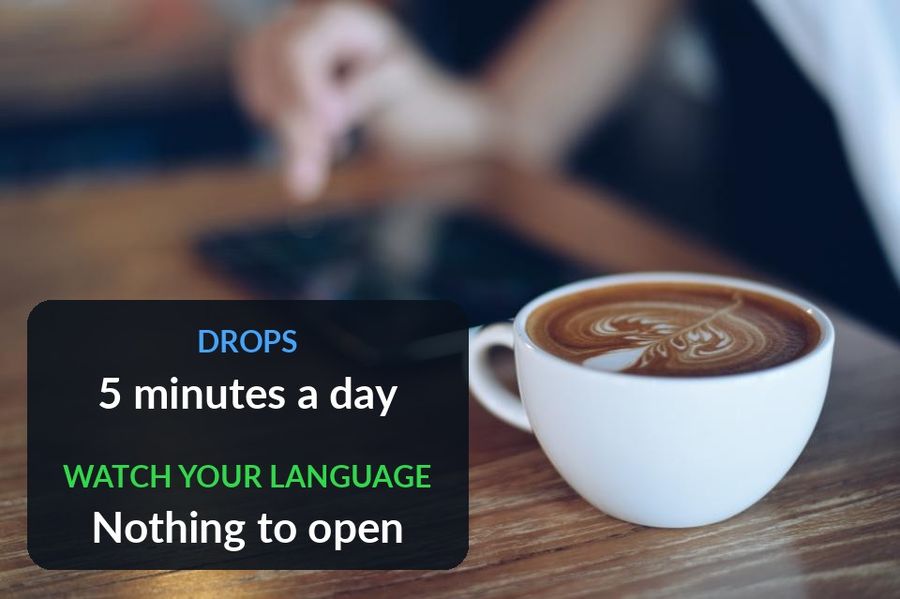 A phone on a cafe table, with the post's point added: Drops asks five minutes a day, Watch Your Language has nothing to open