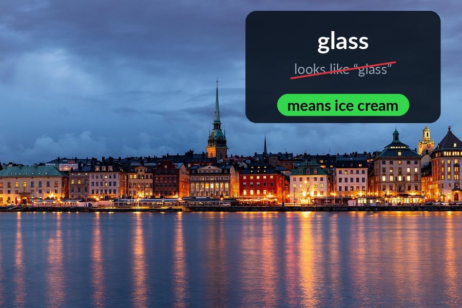 The Stockholm skyline at dusk, with the word glass revealed in the sky: it looks like glass but means ice cream