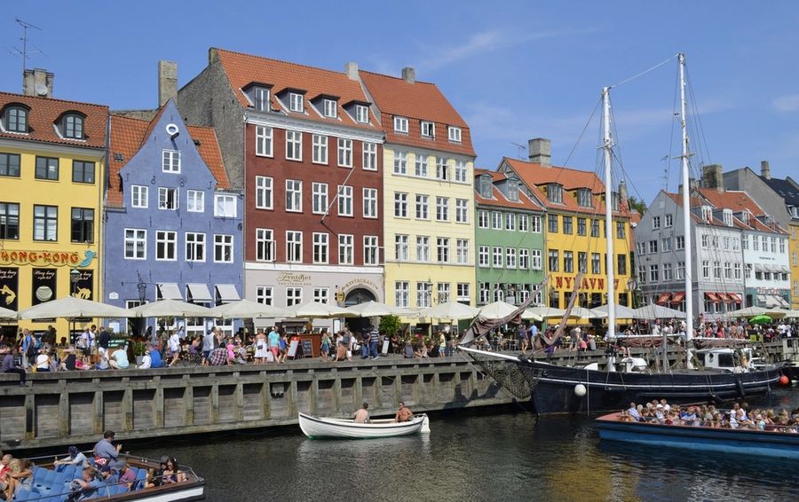Colourful houses and boats along the Nyhavn canal in Copenhagen