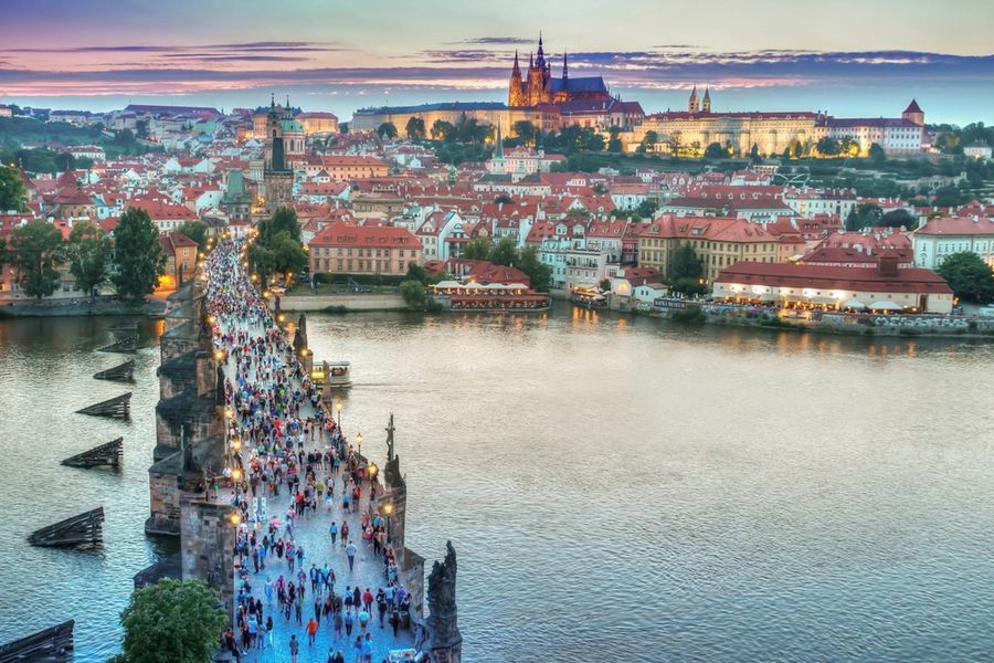 Charles Bridge and Prague Castle over the Vltava at dusk