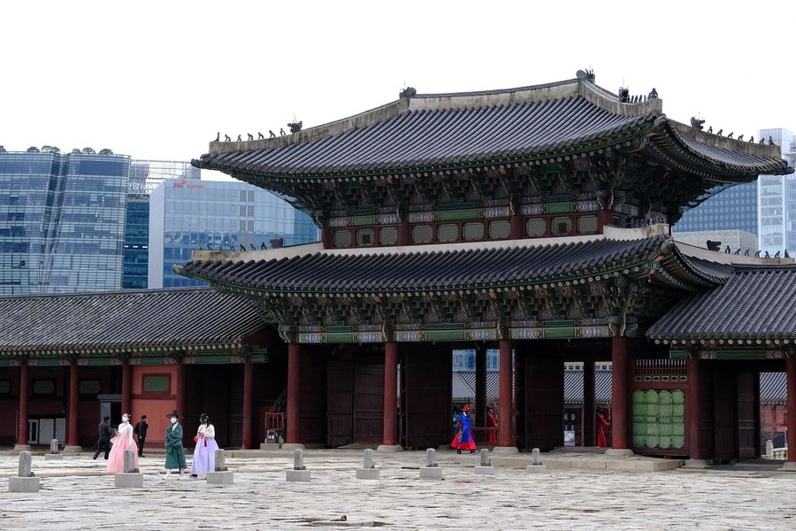 A royal palace hall in Seoul with traditional Korean roofs