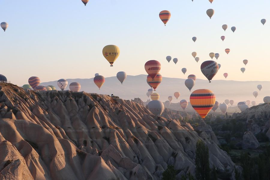 Hot-air balloons rising over the valleys of Cappadocia, Turkey