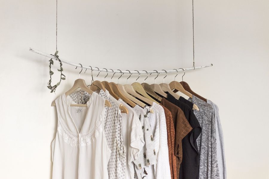 Blouses and shirts hanging on a clothes rail